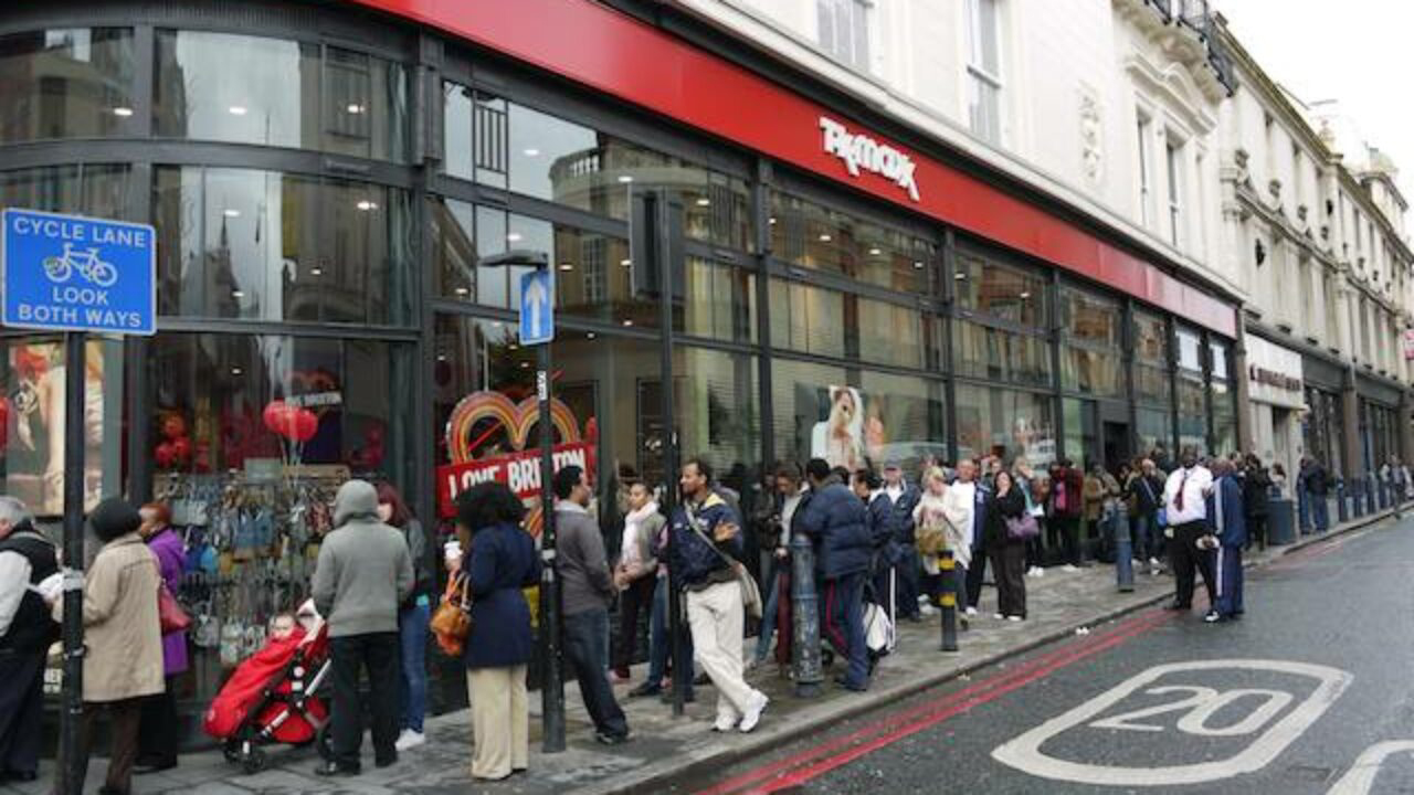 queue of shoppers outside store