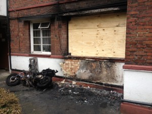BRIXTON BLAZE: 70 people were rescued as flames ripped through the ground floor flat. The burnt out remains of a motorcycle can be seen on the left.