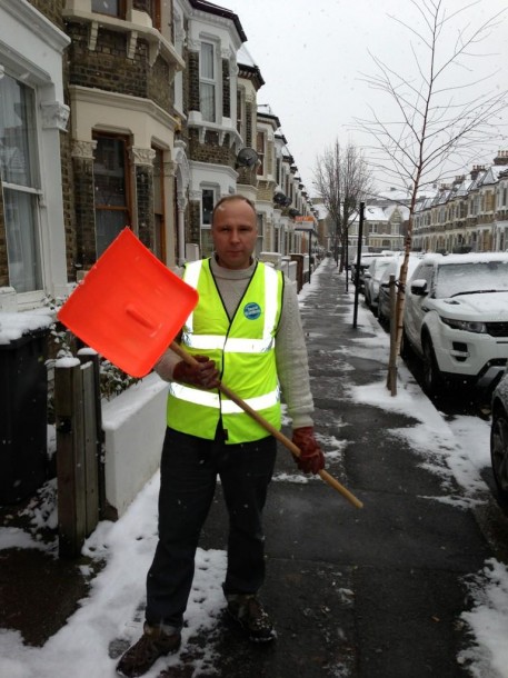 Snow warden James Cornish gets serious with his shovel in Leander Road 