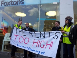 Protesters and security guards outside Foxtons