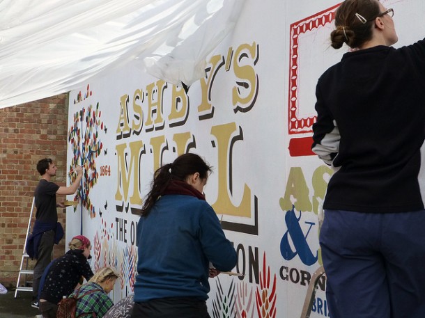 Volunteers paint the mural in Windmill Gardens last weekend. Picture by Nick Weedon on Flickr