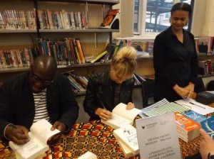 Lucy Robinson and Mike Gayle sign copies of their books for readers