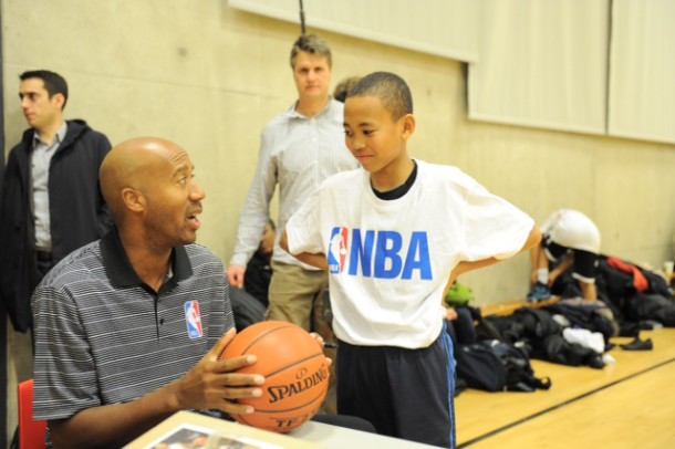 Bruce Bowen with a young basketball player