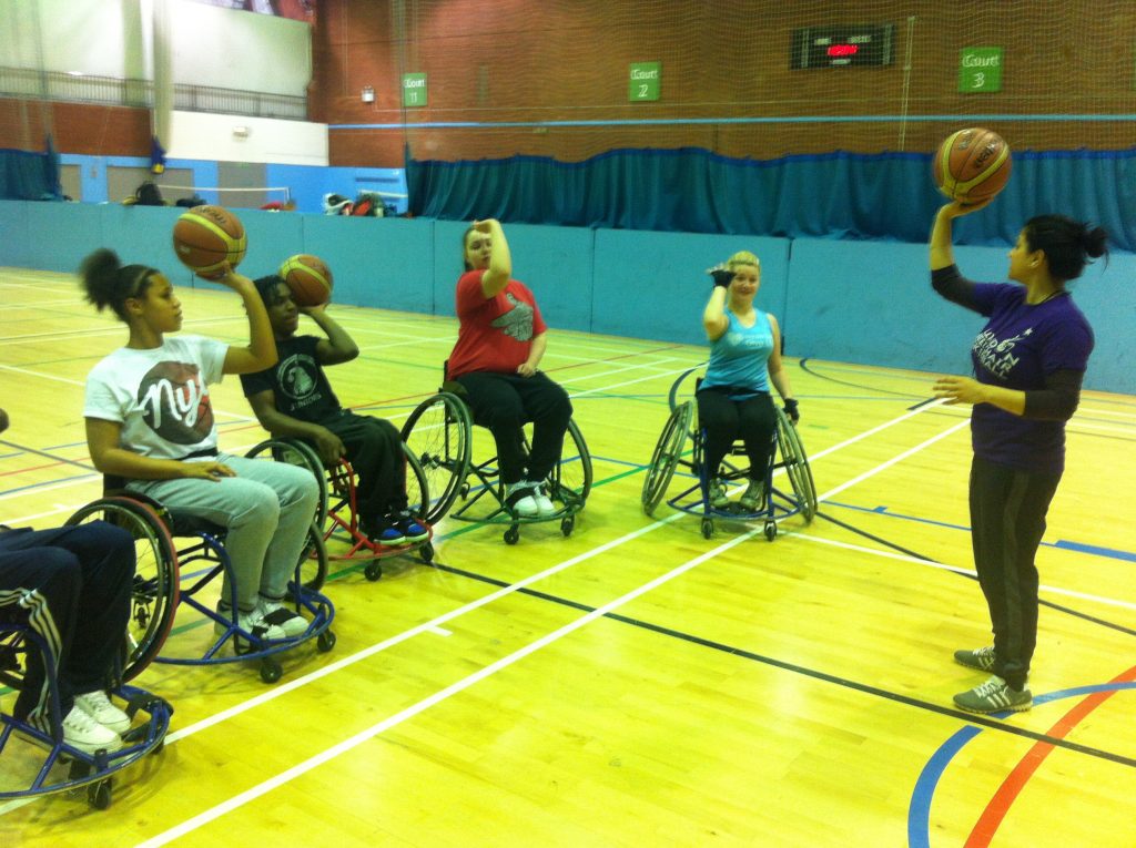 Rukiyah coaching a group of wheelchair basketball players (Photo: Brixton Ballers)