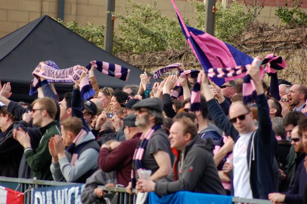 Dulwich Hamlet supporters cheering on their team.