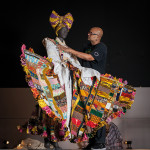 Brixton-based designer Ray Mahabir with his costume commisioned by the British Library. Photograph by Toby Keane jpg (1)