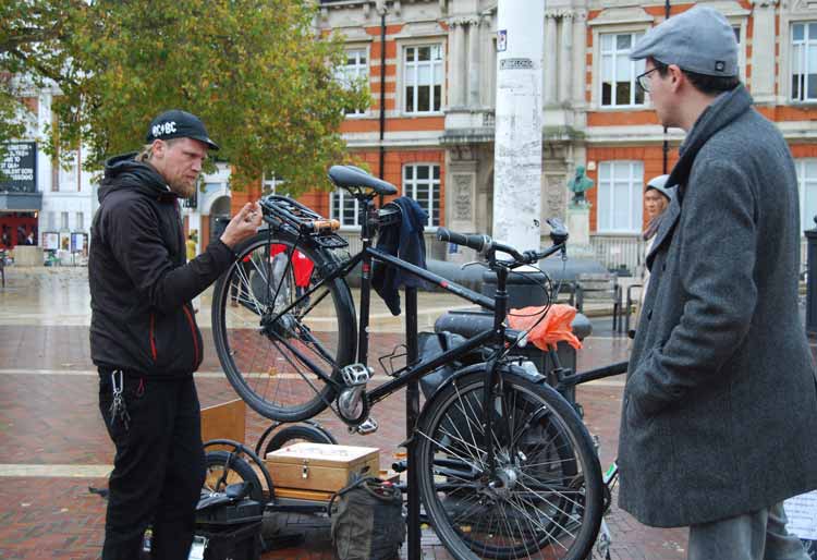 Brixton Cycles Jim Sullivan carrying out a bike repair