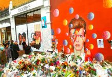 Bowie mural with floral tributes