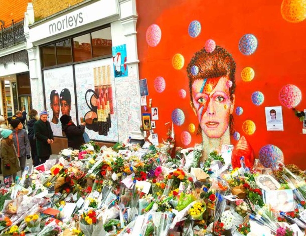 Bowie mural with floral tributes
