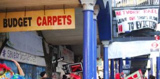 Anti-gentrification protesters outside Budget Carpets