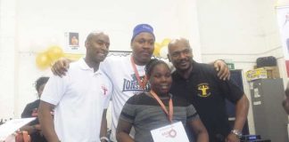 Nine year old Shanakaye at boxing awards with Tim Witherspoon and Dwaynamics coaches