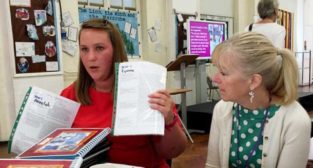 Gill Jones (right), Ofsted's deputy director of early education, looks on as year 1 senior teacher Kirsty Binnie shows examples of Hill Mead’s approach