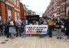 Stand Up to Racism banner at Calais collection on Windrush Square