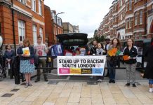 Stand Up to Racism banner at Calais collection on Windrush Square