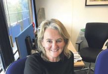 Cll Lib Peck seated in her office