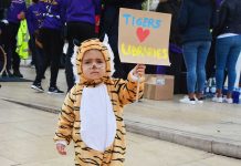 Child protester dressed as tiger