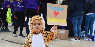 Child protester dressed as tiger
