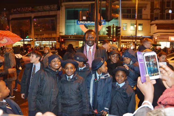 Levi Roots poses for pictures with the Corpus Christi choir
