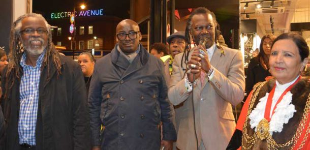 The lights are on – Brixton BID's Michael Smith and Stafford Geohagen with levi Roots and mayor