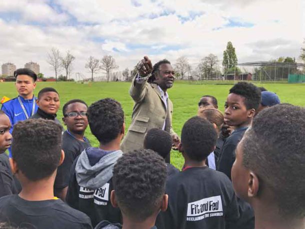 I used to live just over there … Levi Roots talking to young football players in Brockwell Park