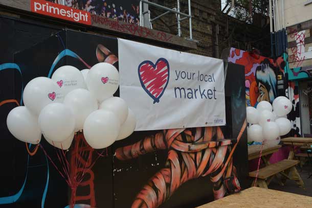 Love Your Local Market banner in the Village