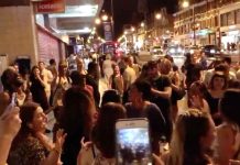 11pm. Mass singalong outside Brixton Tube station – yards from people's homes