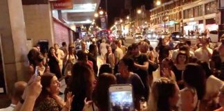 11pm. Mass singalong outside Brixton Tube station – yards from people's homes