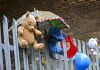 Stuffed toys on railings in Valentia Place