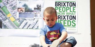 Child in Superman Costume at Brixton Green meeting