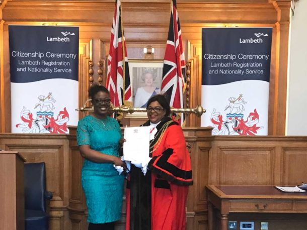 Laurencia Kwanga (left) receiving her citizenship certificate from Cllr Marcia Cameron, mayor of Lambeth