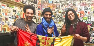 Gnawa players with flag