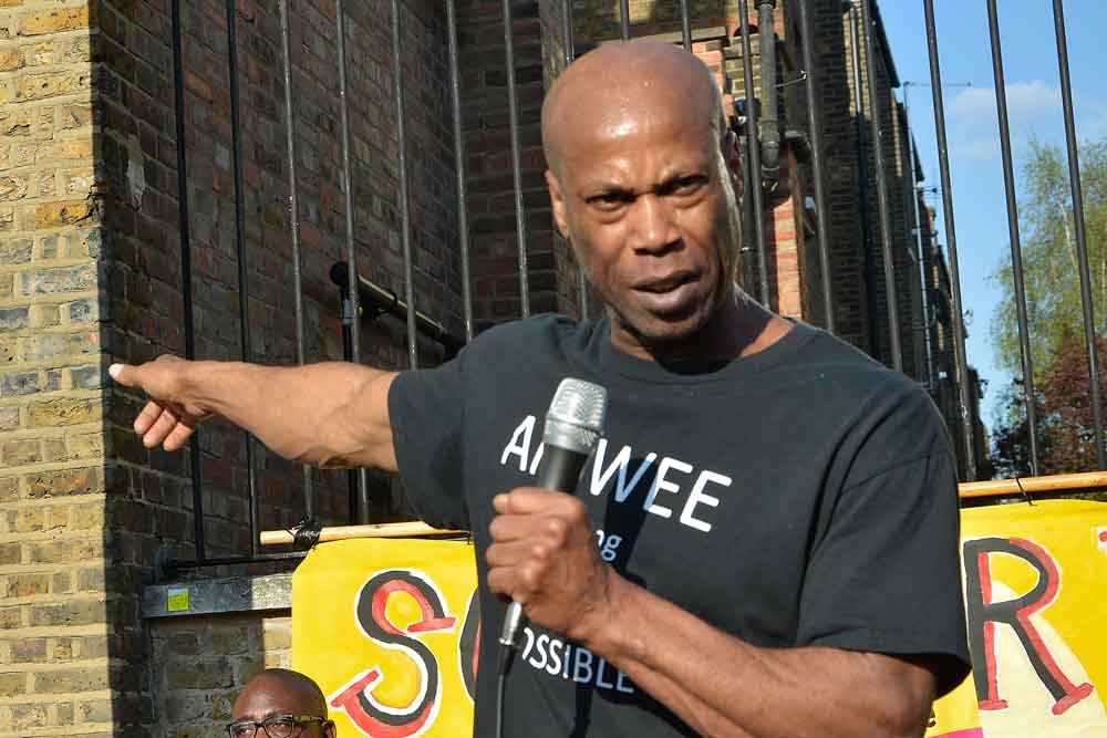 man speaking at rally