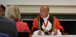 New mayor Christopher Wellbelove presides at the council meeting's new venue