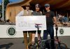 Alex Briggs with cheque for winning Brompton race