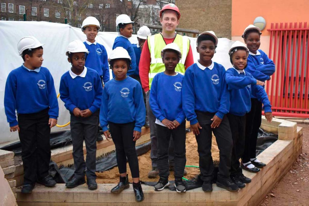 children outside in building site