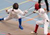 two fencers mid-battle