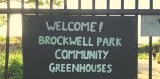 sign reading welcome to brockwell park community greenhouses