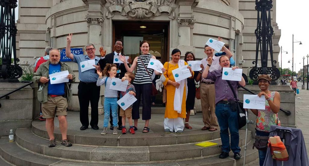 St Martin's residents celebrate victory on steps of Town Hall
