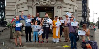 St Martin's residents celebrate victory on steps of Town Hall