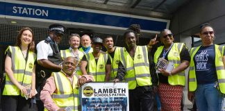 Scheme organisers and Lambeth council leader Jack Hopkins pose for pictures outside Brixton Tube