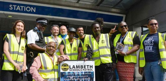 Scheme organisers and Lambeth council leader Jack Hopkins pose for pictures outside Brixton Tube