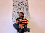Artist Djofray Makumbu artist with one of his paintings exhibiting in Brixton Library 10 October