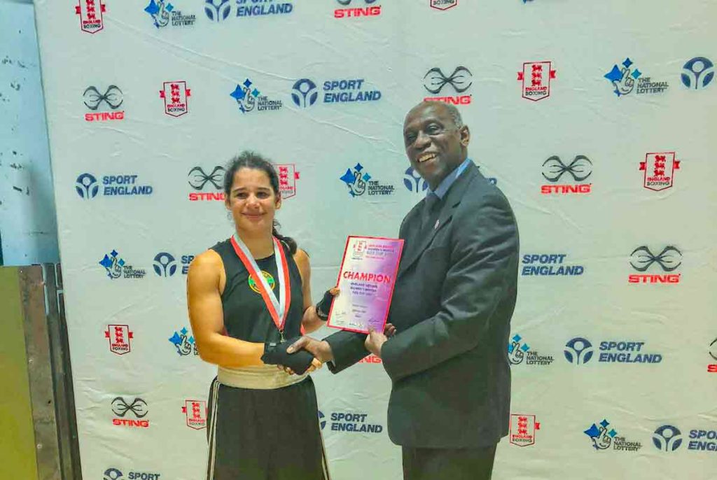 Vivien Parsons receives the 63kg Junior A trophy at the 2019 Female Box Cup at Guildford Spectrum from England Boxing director Michael Norford