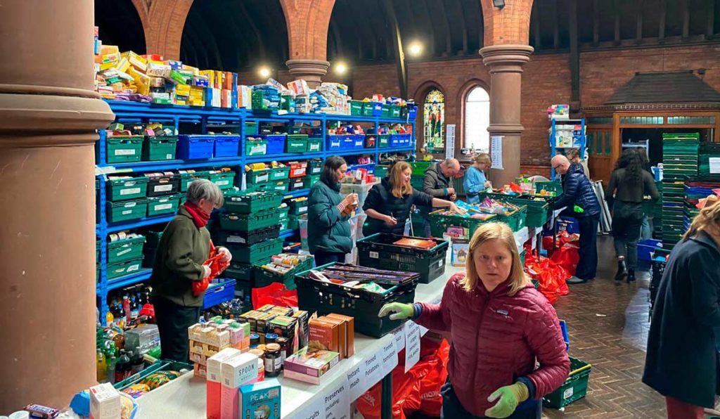 Norwood and Brixton Foodbank depot: volunteers packing