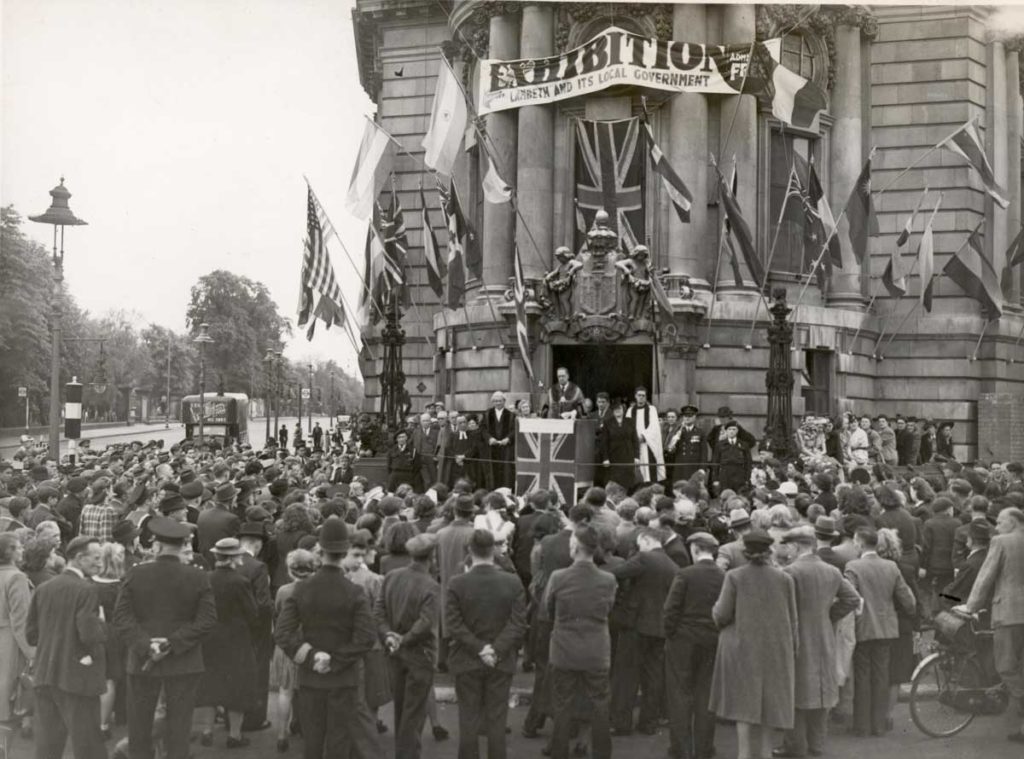 VEDay celebrations in Brixton with the Mayor, Alderman W. Lockyer, and other officials addressing the crowd from the steps of Lambeth Town Hall - 8th May 1945