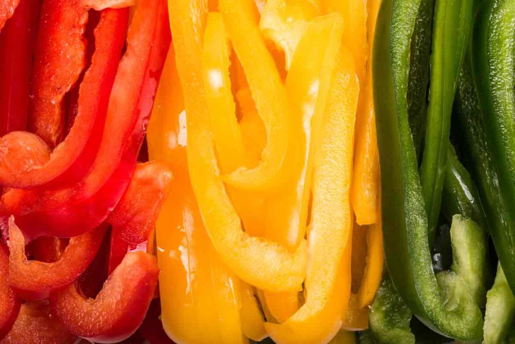 red yellow green peppers sliced