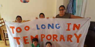 family with banner