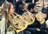 French horn players open air