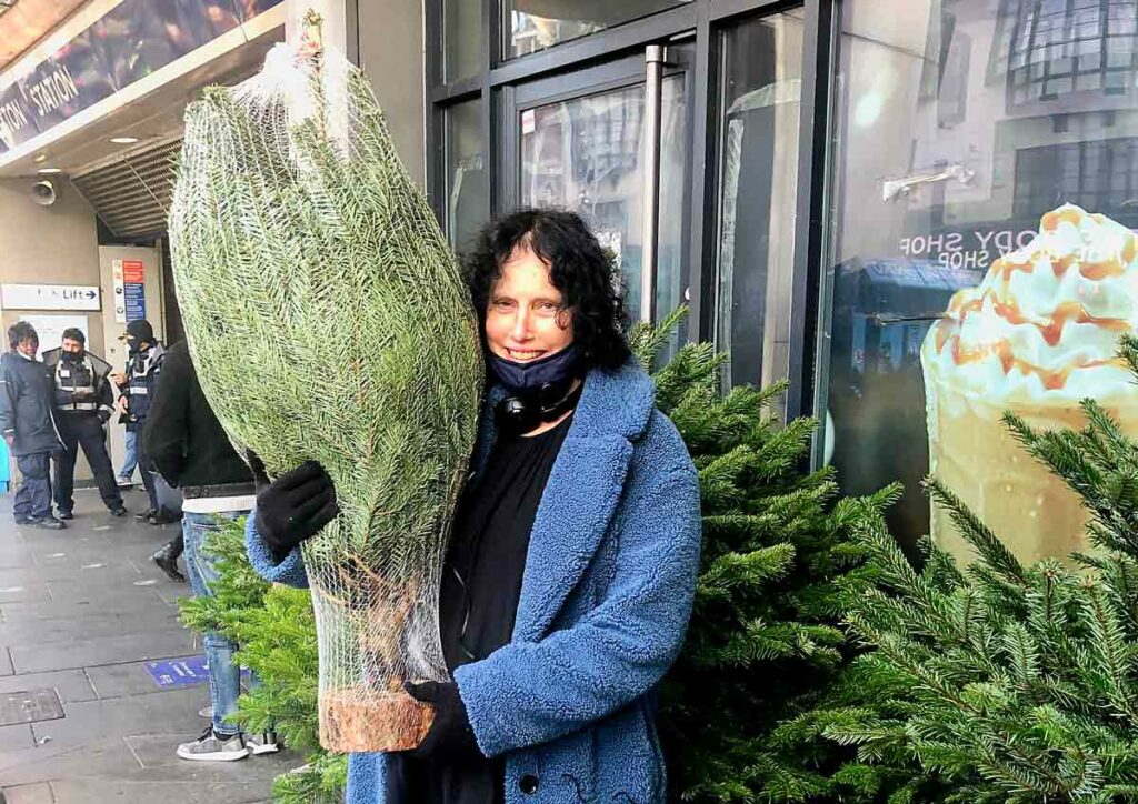 woman with Christmas tree