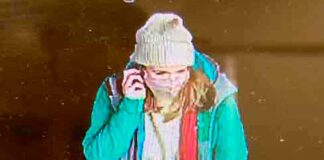 CCTV image of woman on mobile phone